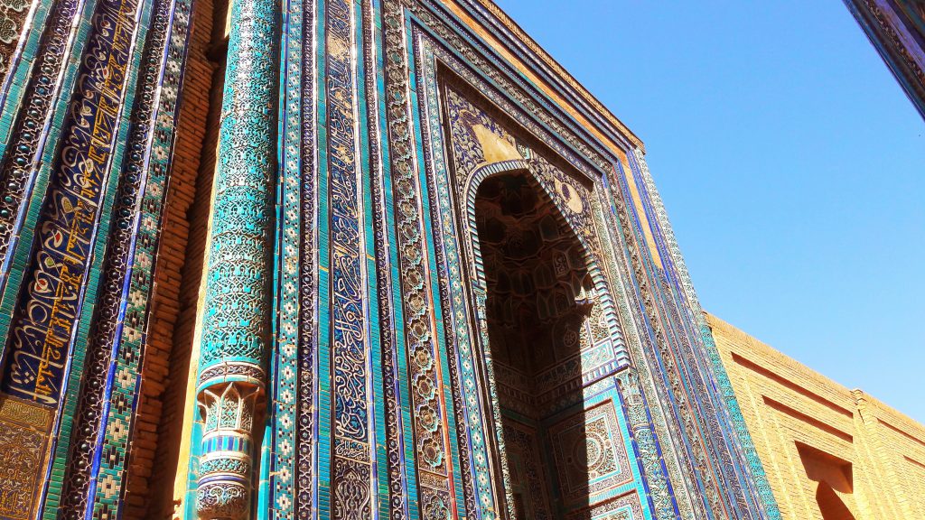 Info Shymkent - A mausoleum at Shah-i-Zinda with beautiful cyan and yellow oriental ornaments.