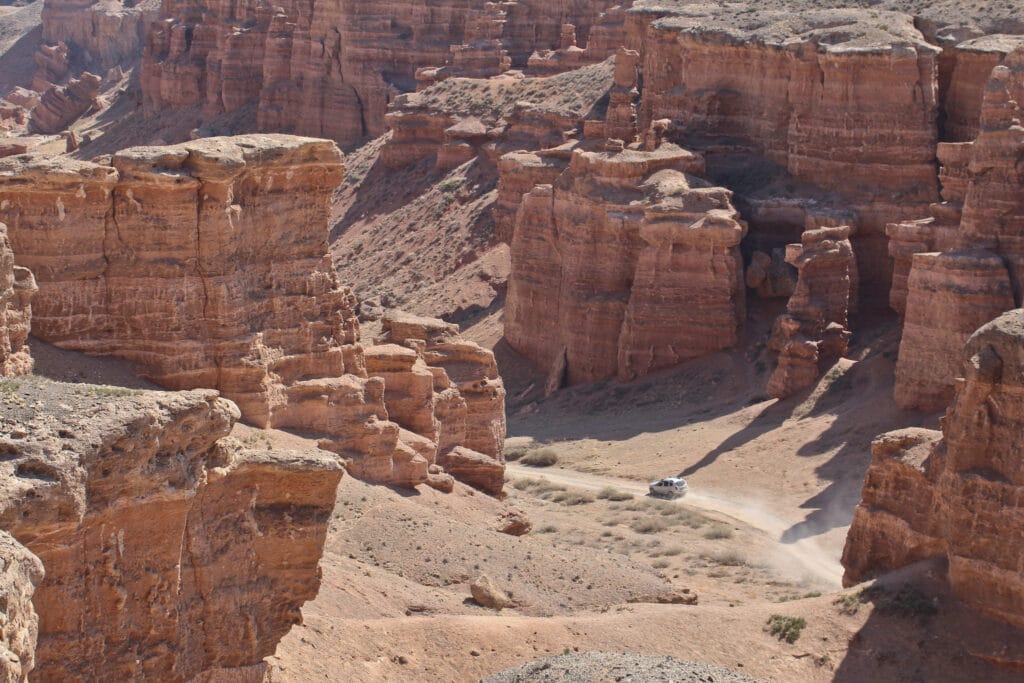 Info Shymkent - Car in Sharyn Canyon, Kazakhstan