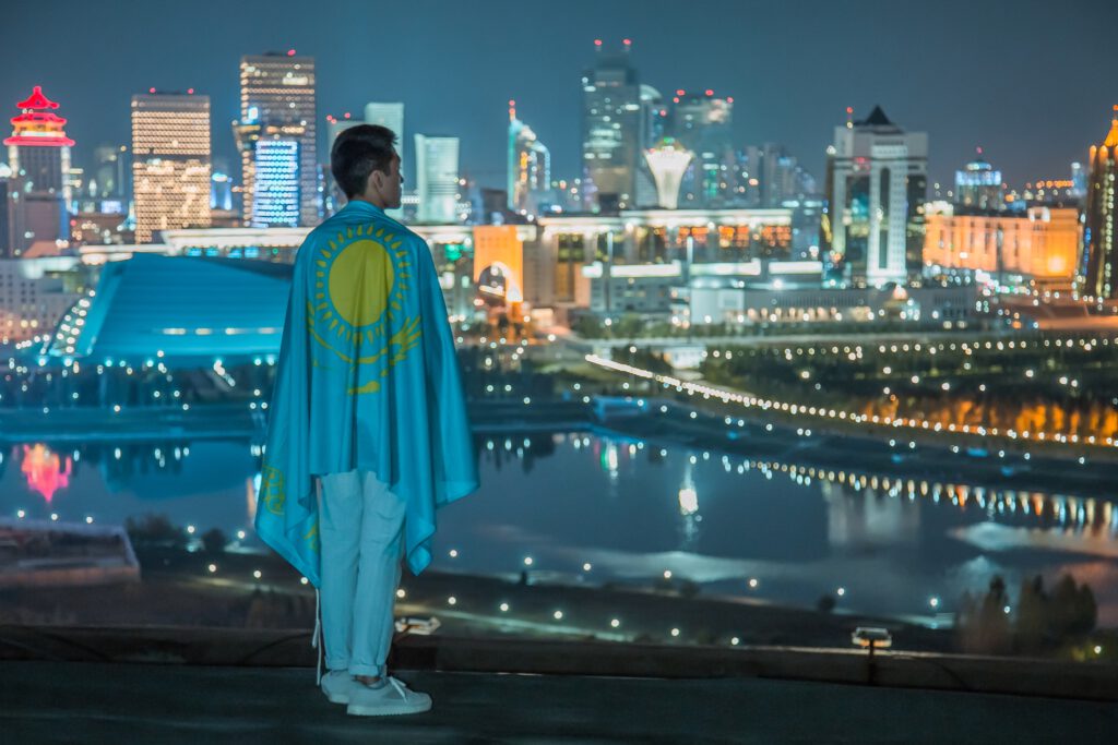 Info Shymkent - Portrait Photographer Zhambay took a picture of a patriot with flag in Nur-Sultan, Kazakhstan