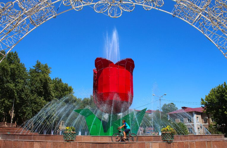 Info Shymkent - A Boy is Cycling around Tulip Fountain in Shymkent, Kazakhstan