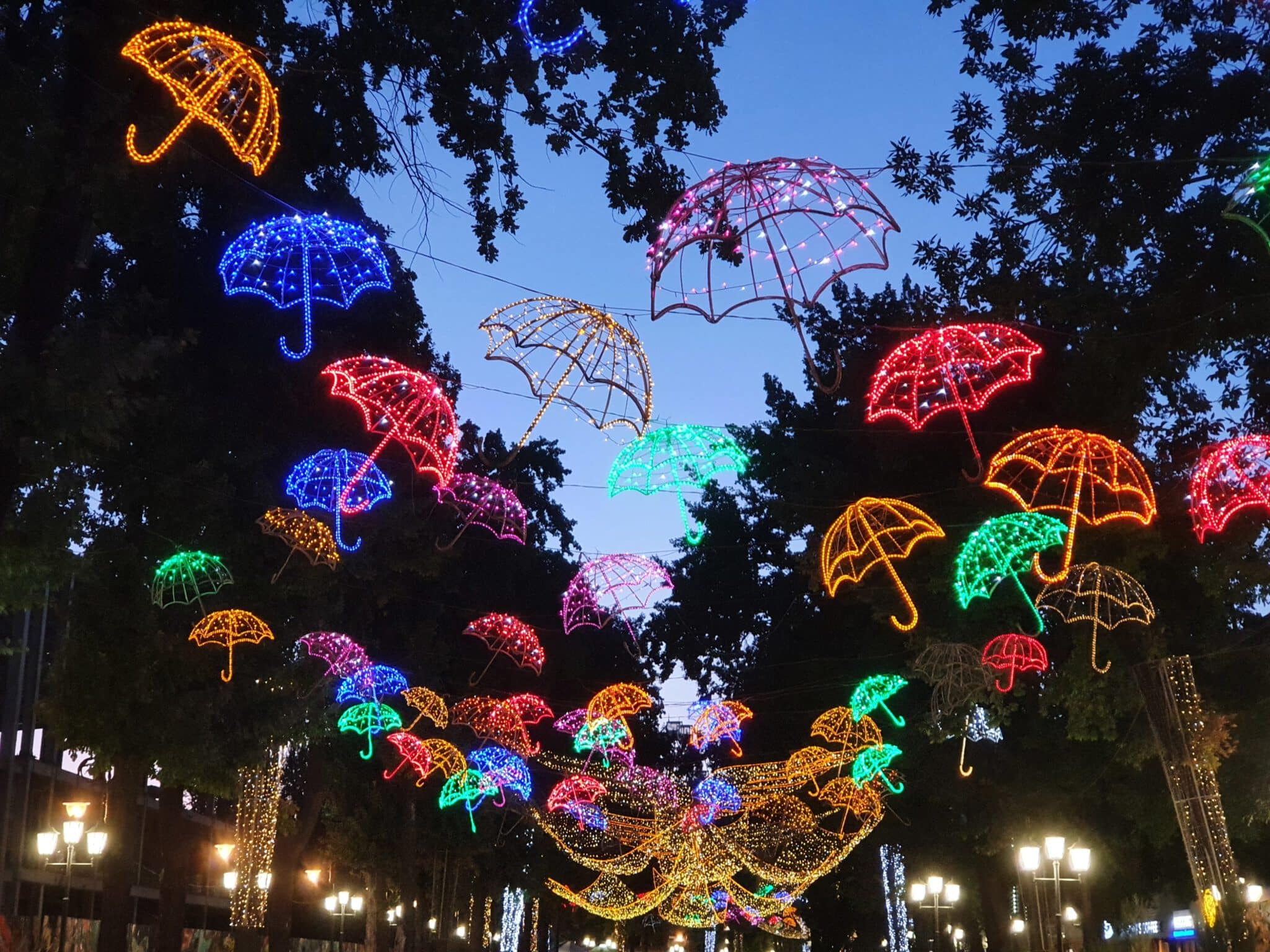 Info Shymkent - Flying angels and umbrellas lightning up the pedestrian street Arbat in Shymkent